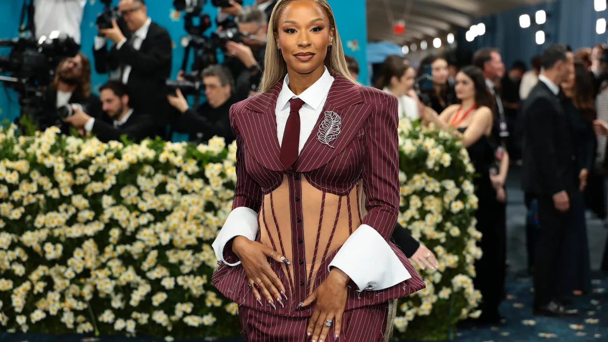 savannah james wows in backless black dress alongside lebron at time100 sports gala