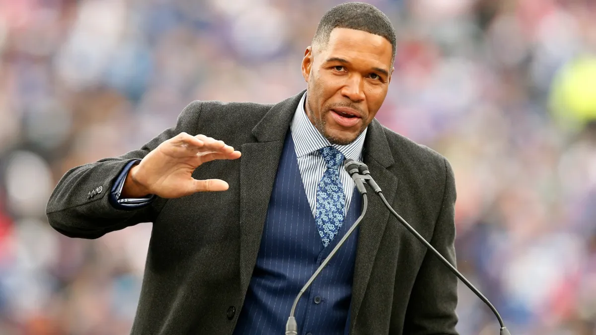 why michael strahan defended criticism over controversial chris johnson als interview