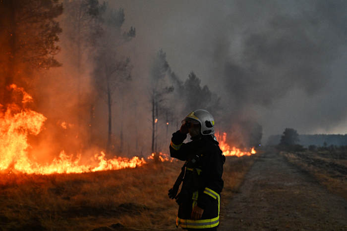 macron calls crisis meeting as monster wildfires drive 250,000 from their homes
