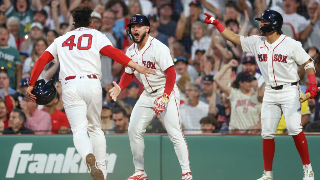 red sox linked to trade for 27 home run all star catcher yankees want