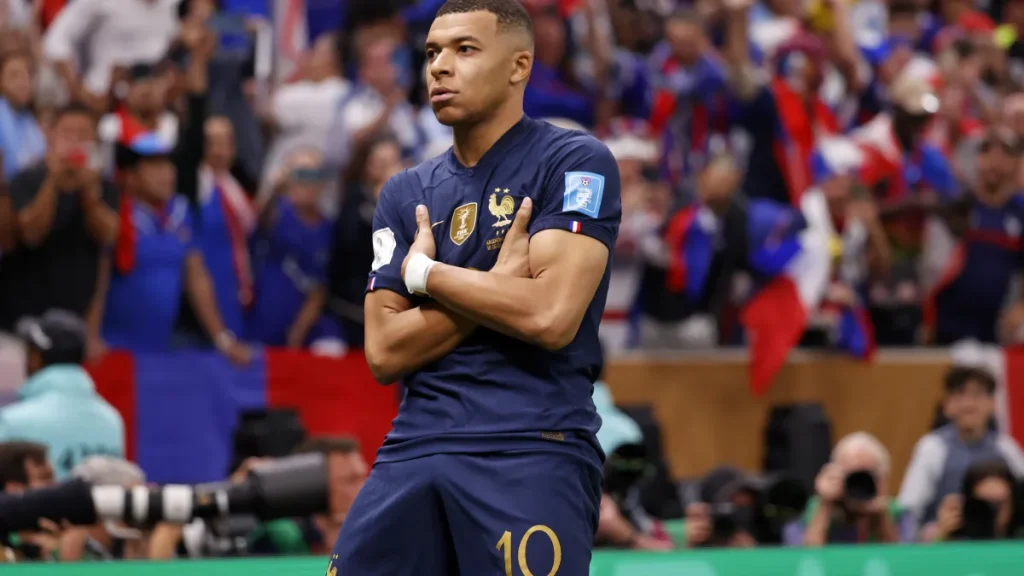 kylian mbappe goal celebration, explained: why france star folds arms after scoring