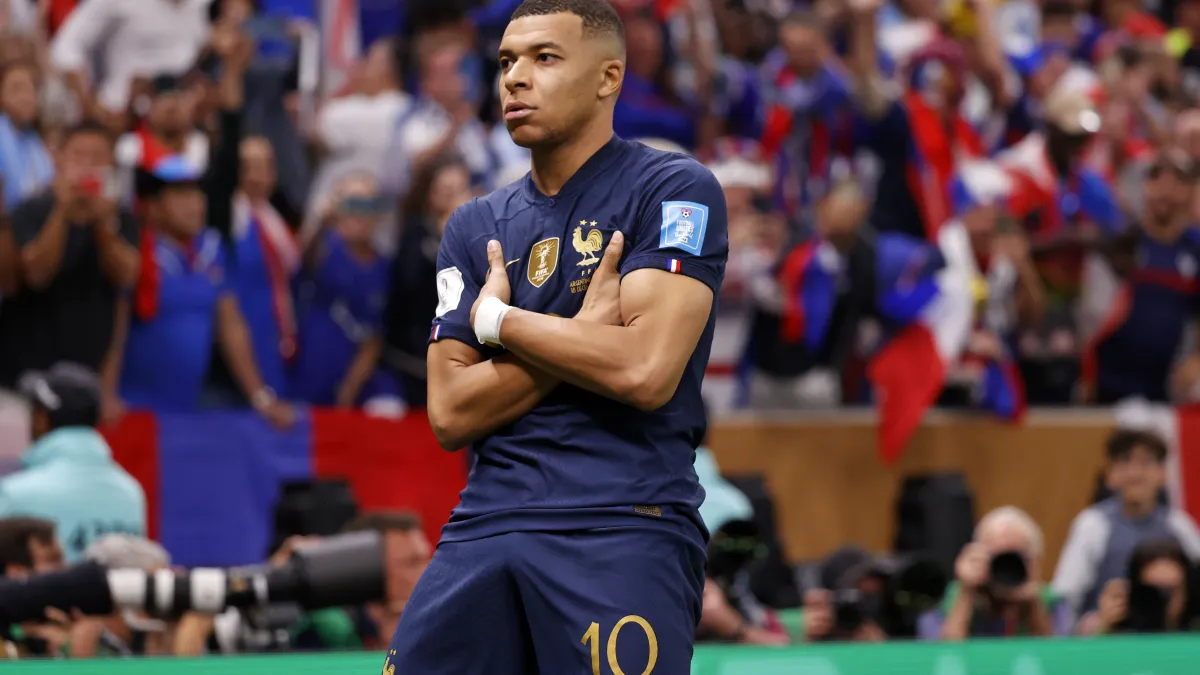 kylian mbappe goal celebration, explained: why france star folds arms after scoring