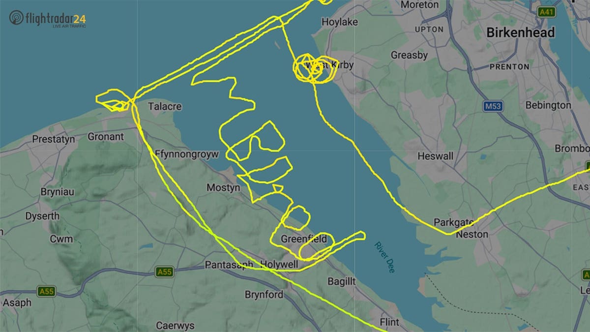 pilot goes viral for spelling out ‘i’m bored’ in sky over northwest england