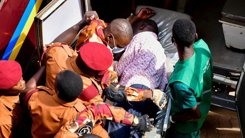 veteran ugandan opposition politician collapses in court and in icu, his wife says