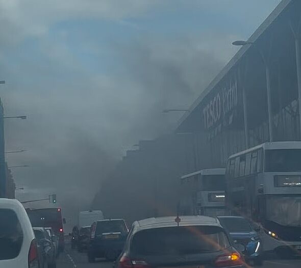 horror as huge fire erupts at tesco supermarket as shoppers run for their lives