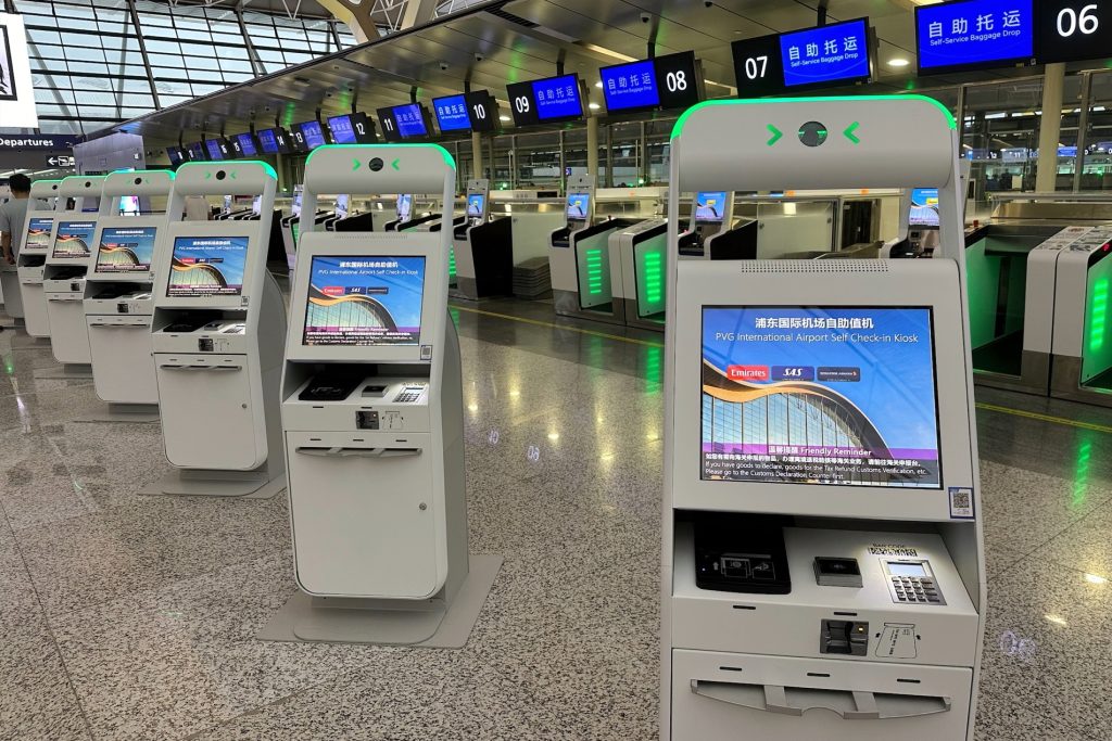 shanghai pudong airport installs 52 kiosks and 14 self service bag drops from sita