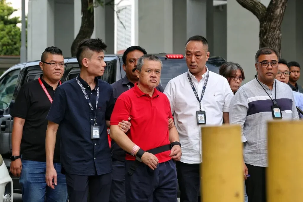 lengkok bahru murder: man accused of killing neighbour taken back to crime scene