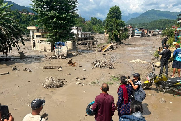 flash flood tears through nepal valley, leaving almost 400 tourists missing, including americans