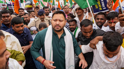 bihar: water cannon used as rjd leaders march to raj bhavan; tejashwi yadav detained | india news