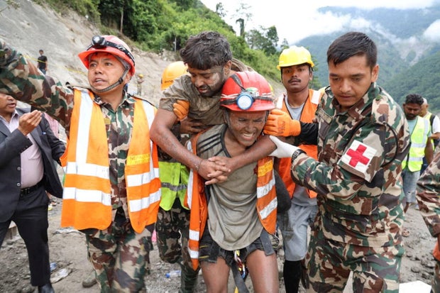 2 trapped nepal hydropower tunnel workers rescued 9 days after devastating floods