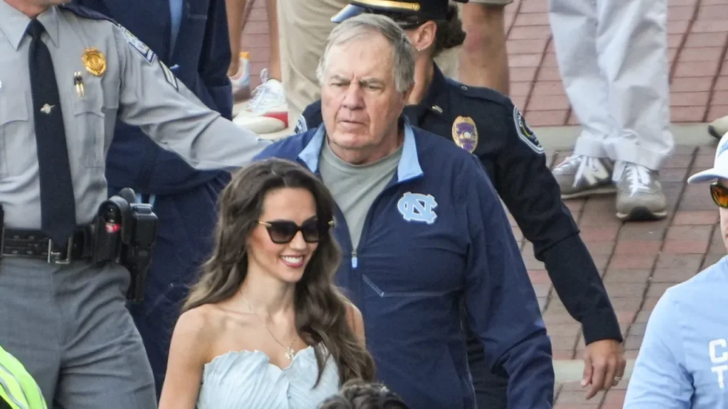 jordon hudson shines in strapless blue jumpsuit at unc game to support bill belichick