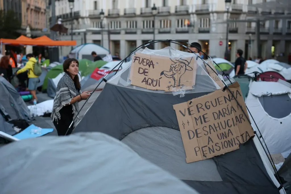 madrid protest camp grows after outrage over eviction of 87 year old woman