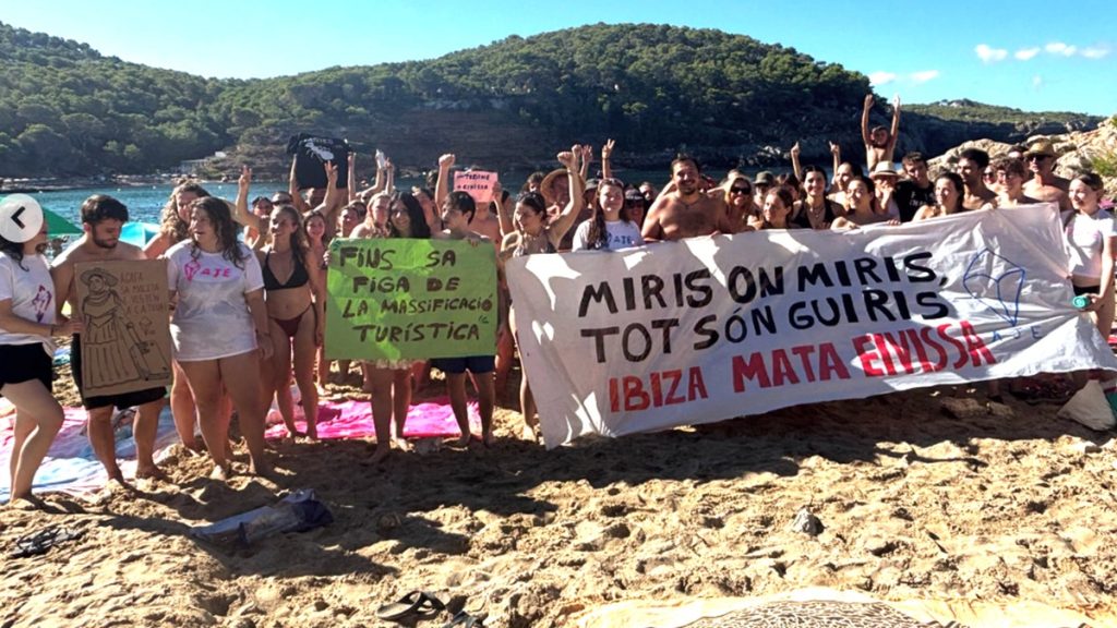 some 100 ibiza residents occupied their beach due to tourist overcrowding