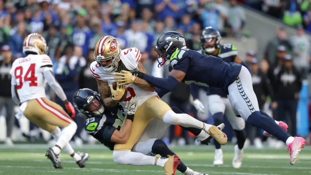 49ers' mike evans shares real story behind hilarious jersey check of trevon diggs